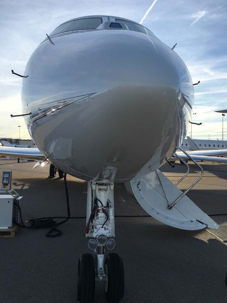 The conventional ice-detecting probes around the nose of this airplane vibrate at a specific frequency, which decreases when covered in ice. Image courtesy: Nilton Renno, University of Michigan.